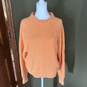 Free People size large mockneck pullover sweater in orange/white.